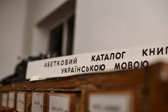 Wooden old fashioned library catalogue with boxes and signs depicting letters in alphabetical order.Studies at the university or college finding paper books and other resources. Writing thesis process
