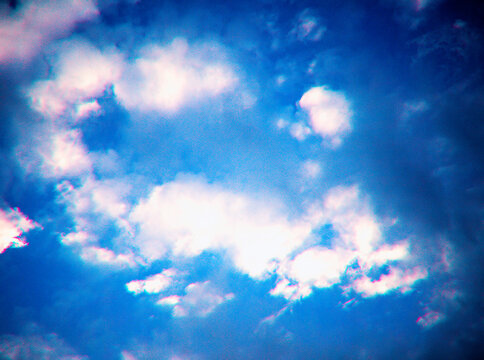 White clouds in blue sky chromatic aberration noise backdrop