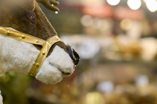 Plush Reindeer with Gold Harness and Christmas Lights