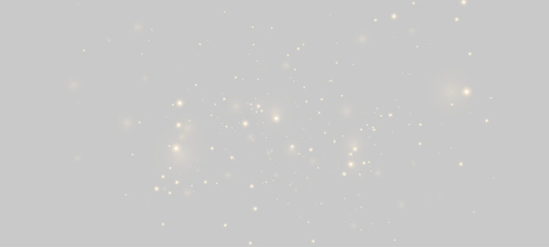 Glowing gold sparkles on neutral light gray background. Sparkling dust particles and soft bokeh lights texture. Abstract festive overlay
