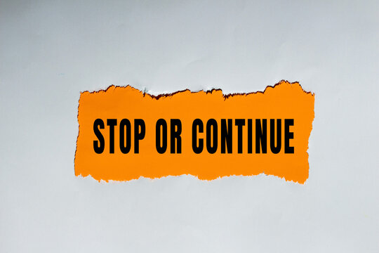 Stop or Continue text concept photo