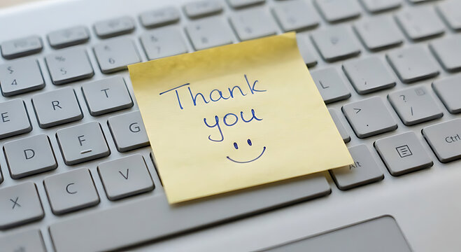 Thank you note on a keyboard expressing gratitude and appreciation for help or support