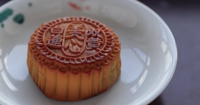 Two egg yolks white lotus seed paste mooncake. Traditional Chinese sweet dessert for celebrating the Chinese mid autumn festival