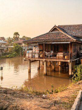 Stored belongings on a wooden stilt house balcony above water