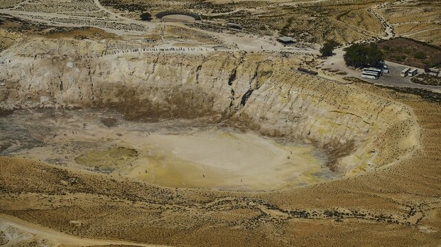 Overview photo of a large crater with a bus station at the edge, volcanism, volcanic island, caldera, Profitis Elias church, Nisyros, Dodecanese, Greek Islands, Greece