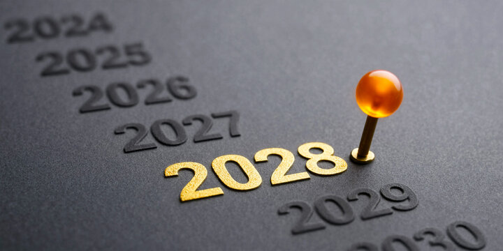 Orange pushpin marking the year 2028 on a timeline calendar