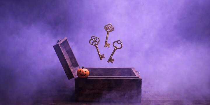 Antique Brass Keys Floating above a Box in Purple Mist