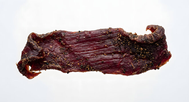 Tibetan yak jerky strip with thick irregular dark-red meat form, leath Isolated on White Background