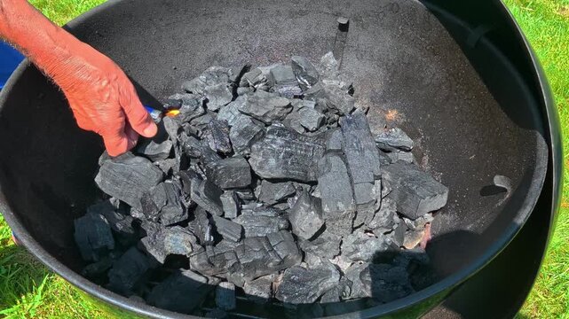 A fire starter accelerates charcoal ignition without producing a chemical odor.