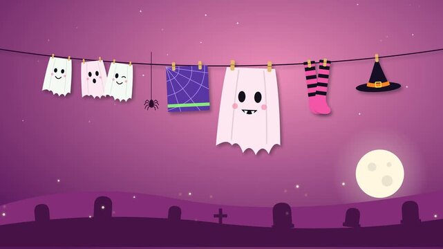 Looping Halloween animation of three baby ghosts and a big ghost with fangs drying on a clothesline with a spider web towel, pink stockings and a witch hat. A spider climbs its thread above graveyard.