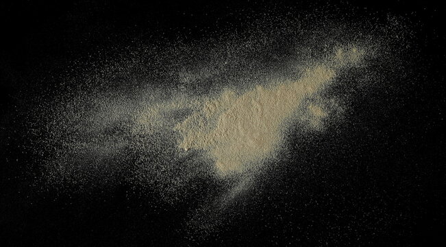 Ashwagandha powder pile, Withania somnifera isolated on black background 