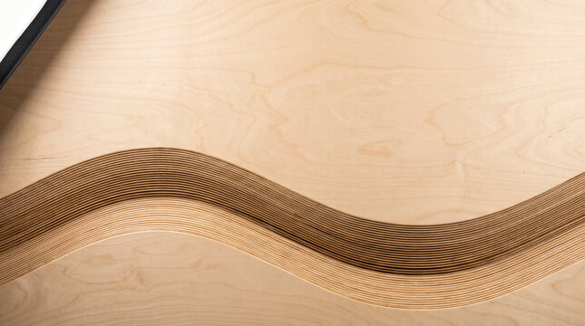 Abstract wavy layers of light wood veneer with grain patterns and darker edges