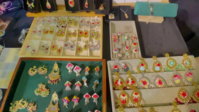 Handcrafted Floral Jewelry Display with Earrings Rings and Pendants
