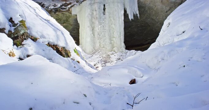 Tilt Up From Snow to Eben Ice Curtain