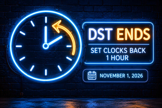 Daylight saving time ends glowing blue neon sign with clock on brick wall blue light time change fall back clock hands calendar date november calendar illumination electricity background