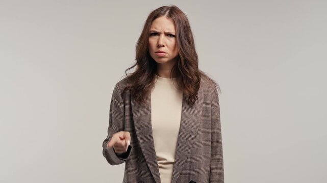 Disagree Adult Woman Disapproving With No Finger Sign, Nods Head, Deny On White. Enough signal, self respect with serious look.