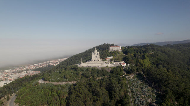 Aerial view of the Sanctuary of the Sacred Heart of Jesus perched on a lush hill overlooking the city of Viana do Castelo, Viana do Castelo Dist, Portugal.