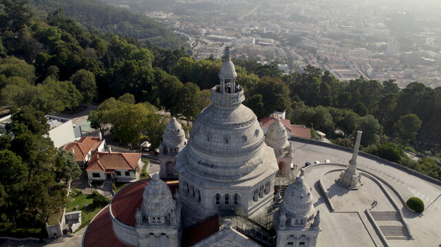 Aerial view of the Sanctuary of the Sacred Heart of Jesus with its ornate stone dome and terraces overlooking the city in Viana do Castelo, Viana do Castelo Dist, Portugal.