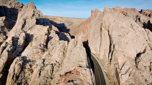 Aerial shot of the amazing San Rafael Reef rock formations with the 70 freeway cutting through it in Utah, USA.