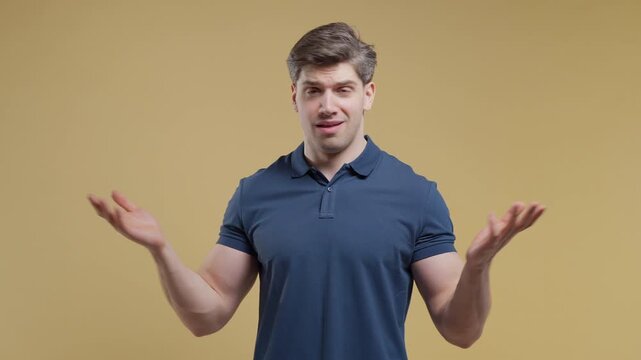 Irritated man showing what gesture, Gesturing Disbelief, Blaming, Asking What Mad. Quarreling handsome guy isolated on beige background.