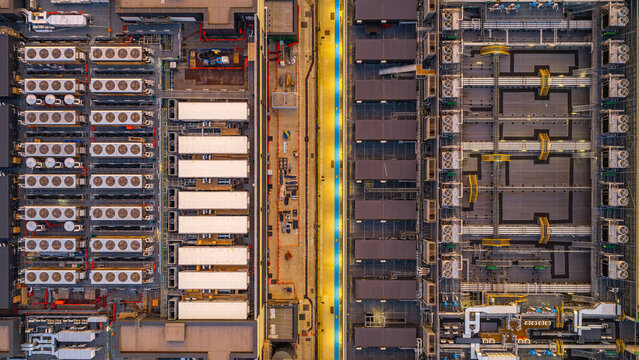 Aerial view of the NTT LON1B Data Centre featuring rows of industrial cooling units and complex server infrastructure in Dagenham, England, United Kingdom.