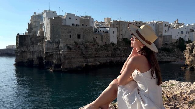 Woman Posing by the Adriatic Inlet in Polignano a Mare, Italy
