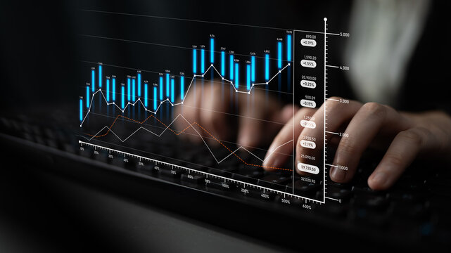 Close-up of hands typing on a keyboard while analyzing financial graphs and data visualizations, reflecting modern investment strategies and business growth potential. Scalp