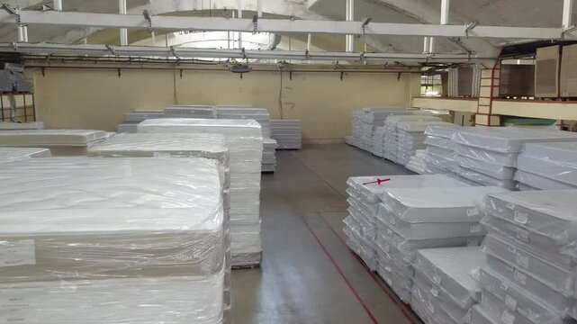 Forward interior flight past stacked mattresses in Klin