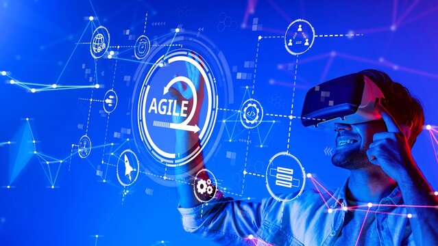 A young man experiences virtual reality while interacting with a vibrant digital interface, representing the excitement and potential of agile technology and innovation. Raster