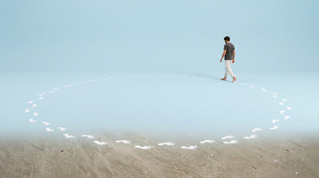 Barefoot male walking on sand, leaving white footprints in a circular path, symbolizing journey, choice, and the passage of time