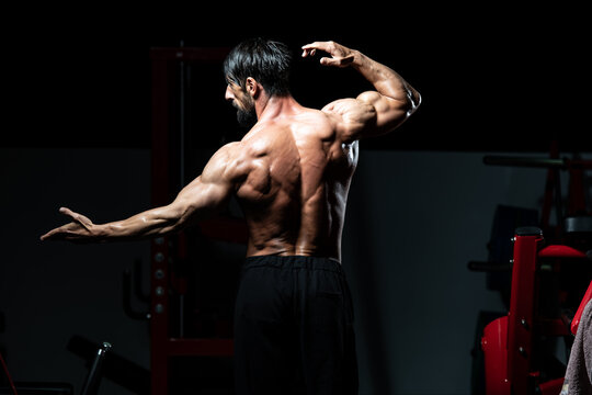 Middle Age Man Bodybuilder Flexing Back Pose