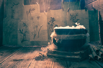 Naklejka premium Old witch cauldron with recipe and full of scrolls.