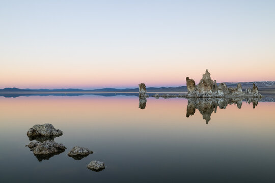 Mono lake at sunset with unique rock formations reflecting
