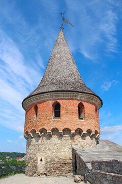 Ancient Day Tower of Kamianets-Podilskyi Castle under blue sky in Ukraine