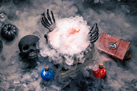 Magic potion brews inside an iron cauldron.