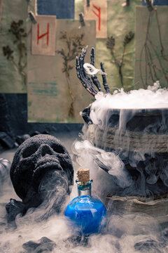 Dark background frames a steaming magic pot.