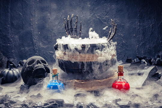 Witchcraft setup with bubbling pot and potions.