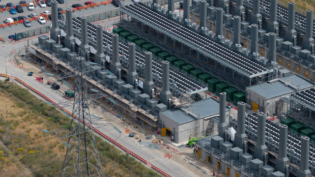 Aerial view of the Thurrock Flexible Generation Substation featuring industrial power generation units and electrical infrastructure in Tilbury, England, United Kingdom.