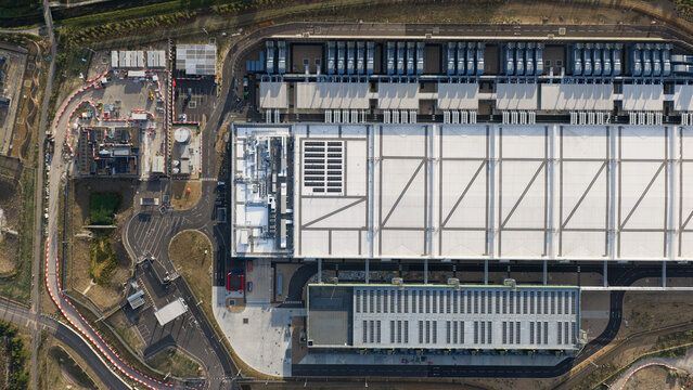 Aerial view of the Google Data Centre in Waltham Cross featuring large industrial buildings, rooftop infrastructure, and access roads in Cheshunt, England, United Kingdom.