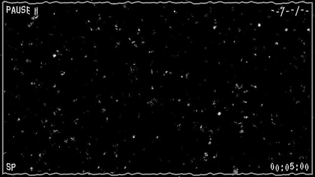 Retro analog vhs pause screen with grainy static noise and old timecode. Vintage VHS tape noise and dust overlay on black background