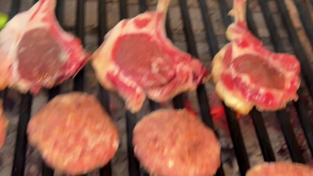 Grilling Meatballs and Lamb Chops Over a Traditional Wood Fire Barbecue