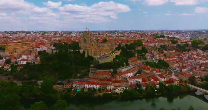 Aerial view of Beziers, charming historic city in southern France, known for the Cathedral of Saint Nazaire, the Canal du Midi, picturesque streets, traditional French architecture
