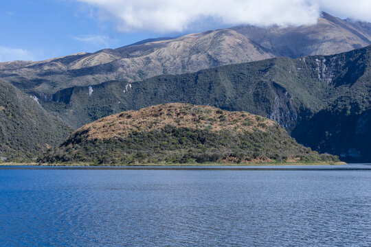 Cuicocha lake crater and volcanic island with Andes mountains in Cotacachi, Imbabura, Ecuador