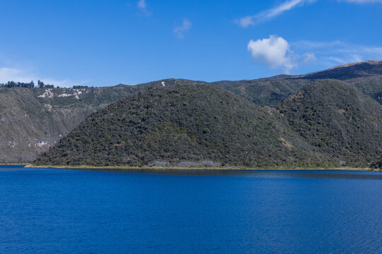 Cuicocha lake crater and volcanic island with Andes mountains in Cotacachi, Imbabura, Ecuador