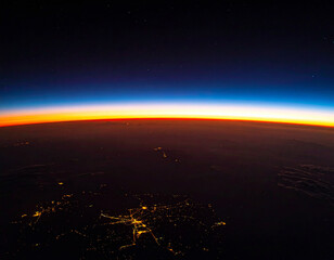 Fototapeta premium Breathtaking aerial view of Earths glowing horizon at sunrise from space. Nobody present. This ethereal, cinematic image evokes wonder, unity, and cosmic scale, perfect for global technology.