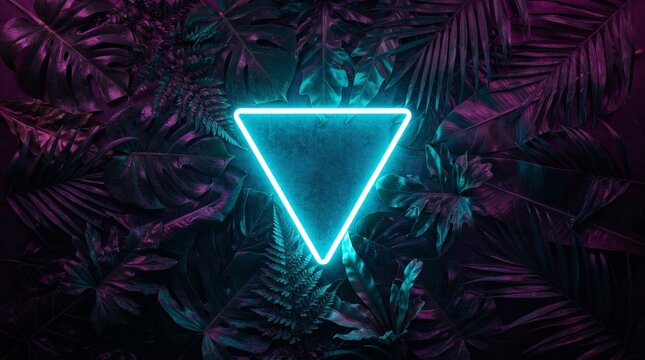 Creative fluorescent color layout made of tropical leaves. Flat lay neon colors. Nature concept.