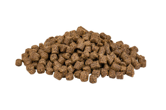 Large pile of dark brown animal feed pellets, with a textured surface, is centrally placed on a clean white background