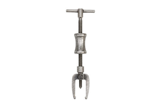 Old vintage metal gear puller tool, with a threaded shaft and two claw-like arms, isolated on a clean white background