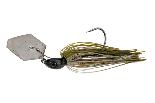 Black and green fishing jig with a metal blade and a sharp hook, captured on a clean white background
