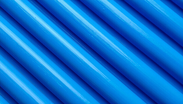 Abstract background of shiny blue parallel cylindrical pipes or tubes. Detailed macro shot of diagonal royal blue plasticine or modeling clay texture with smooth parallel ridges and glossy highlights.